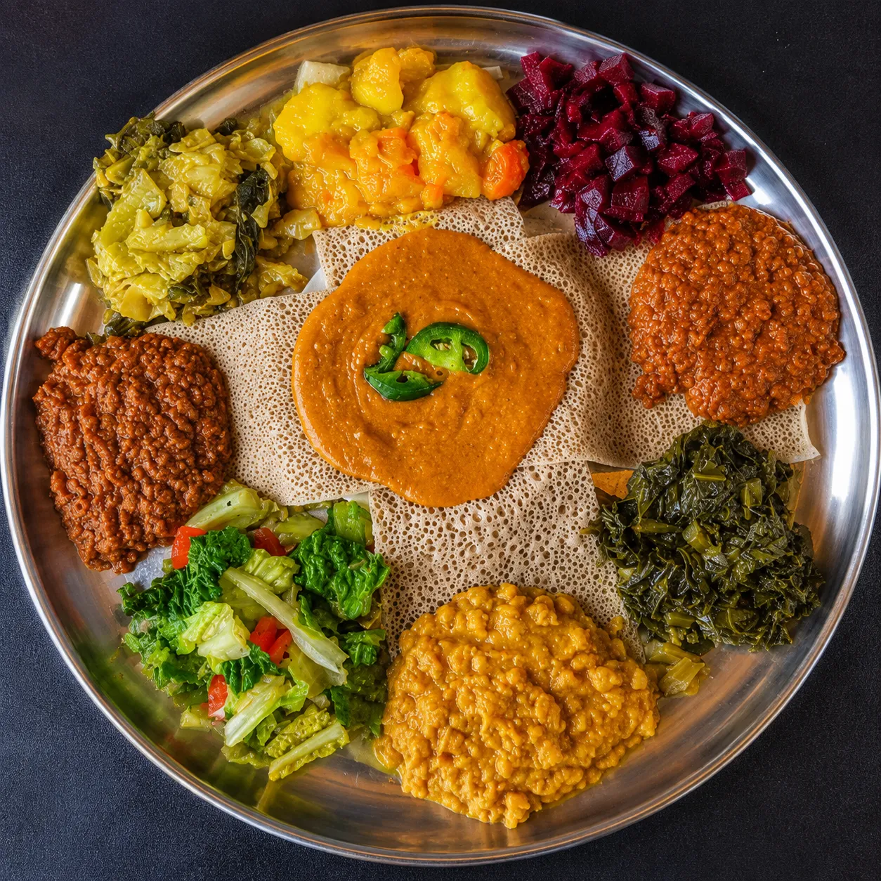 Vegie combo injera platter with lentils and vegetables, vegan Ethiopian food in Winnipeg